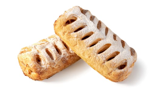 Two layers of apple strudels, stacked to perfection, stand out against a pristine white backdrop. Indulge in the delicate balance of flaky pastry and sweet, spiced apple filling