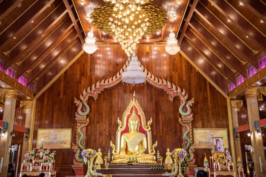 Buddha inside of Wat Maha Wanaram in the city Udon Ratchathani and Province Ubon Ratchathani in Thailand.  Thailand, Ubon Ratchathani, November, 23, 2023