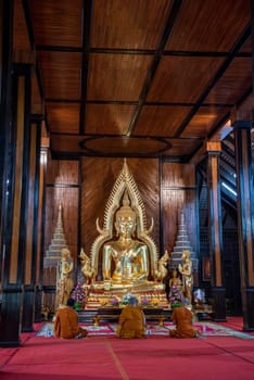 Buddha inside of Wat Luang in the city Udon Ratchathani and Province Ubon Ratchathani in Thailand.  Thailand, Ubon Ratchathani, November, 23, 2023