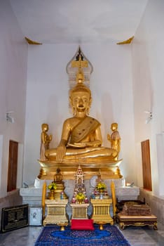 Buddha inside of Wat Luang in the city Udon Ratchathani and Province Ubon Ratchathani in Thailand.  Thailand, Ubon Ratchathani, November, 23, 2023