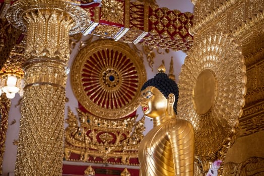 Buddha inside the Sri Maha Pho Chedi of Wat Phra That Nong Bua Temple in city centre and Province Ubon Ratchathani in Thailand.  Thailand, Ubon Ratchathani, November, 24, 2023