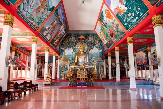 a Buddha inside of Wat Ban Na Kwai in city centre and Province Ubon Ratchathani in Thailand.  Thailand, Ubon Ratchathani, November, 24, 2023
