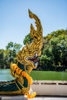 a Naga on the Ship Temple of Wat Sa Prasan Suk in the city centre of Udon Ratchathani and Province Ubon Ratchathani in Thailand.  Thailand, Ubon Ratchathani, November, 24, 2023
