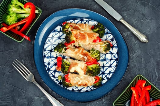 Tasty meat rolls or roulades stuffed with broccoli and peppers. Pork roll filled.