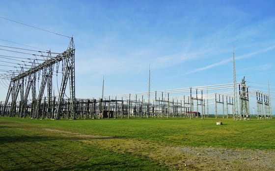 Electric power station under blue sky in summer