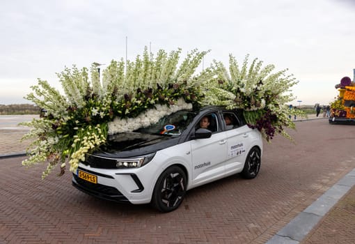 Noordwijk, Netherlands - April 22, 2023: Cars decorated with flowers taking part in the Bloemencorso Bollenstreek the annual spring flower parade from Noordwijk to Haarlem in the Netherlands.