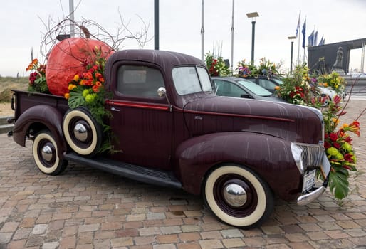 Noordwijk, Netherlands - April 22, 2023: Cars decorated with flowers taking part in the Bloemencorso Bollenstreek the annual spring flower parade from Noordwijk to Haarlem in the Netherlands.