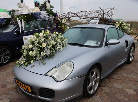 Noordwijk, Netherlands - April 22, 2023: Cars decorated with flowers taking part in the Bloemencorso Bollenstreek the annual spring flower parade from Noordwijk to Haarlem in the Netherlands.
