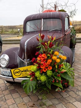Noordwijk, Netherlands - April 22, 2023: Cars decorated with flowers taking part in the Bloemencorso Bollenstreek the annual spring flower parade from Noordwijk to Haarlem in the Netherlands.