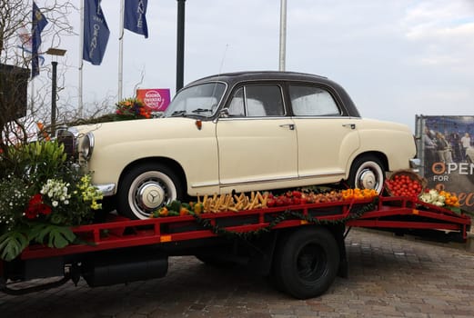 Noordwijk, Netherlands - April 22, 2023: Cars decorated with flowers taking part in the Bloemencorso Bollenstreek the annual spring flower parade from Noordwijk to Haarlem in the Netherlands.
