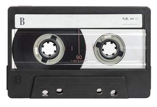 Classic black audio cassette tape with a blank label, isolated on a white background