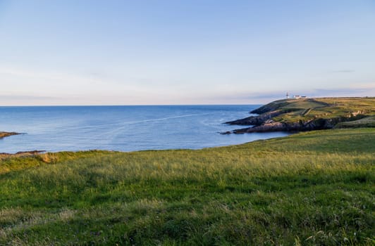 View to Galley Head Lighthouse on picturesque coastline in County Cork,Ireland.