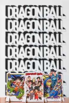japan, tokyo - mar 8 2024: Characters from the Dragon Ball manga and anime series bid farewell to the revered master, Akira Toriyama, by waving their hands against a bokeh background with the logo.