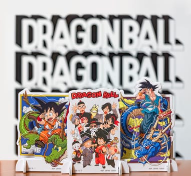 japan, tokyo - mar 8 2024: Mini layer stands representing the characters of the manga, anime and video game franchise Dragon Ball waving goodbye with their hands for the late master Akira Toriyama.