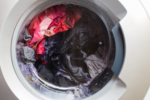 a close view of domestic washing machine at work.