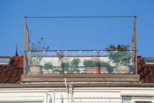 Roof garden with balcony and flower pots, Bremen, Germany, Europe