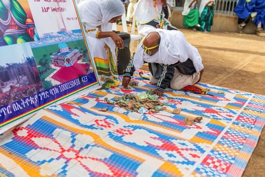 Bahir Dar, Ethiopia - April 21st, 2019: Community raising funds to fix the church during Easter holiday, reflecting the traditions and festive atmosphere of the occasion.