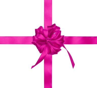 Pink silk ribbon and a tied big bow on an isolated background, top view