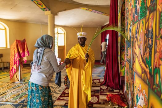 Bahir Dar, Ethiopia - April 21, 2019: Orthodox monk serving worship in Tana Haik Entons Eysus United Monastery on lake Tana near Bahir Dar. Ethiopia Africa