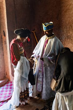 Lalibela, Ethiopia - May 1, 2019: Orthodox Christian baptism ceremony at St. George Church captures a sacred moment in Ethiopian spiritual life.