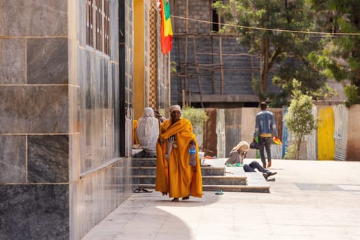 AKSUM, ETHIOPIA, APRIL 27.2019, Old orthodox priest in front of Church of Our Lady of Zion on April 27, 2019 in Aksum, Ethiopia, Africa