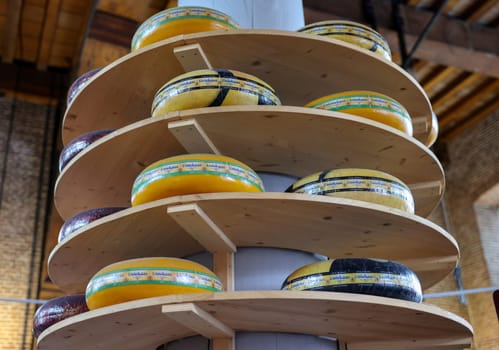 Gouda, the Nehterlands - April 20, 2023: Display of traditional Dutch cheese at local cheese shop in Gouda, the Netherlands