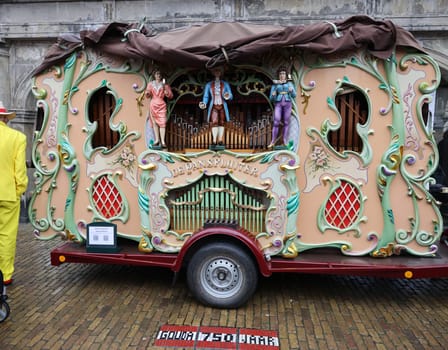 Gouda, the Nehterlands - April 20, 2023: Traditional Dutch street barrel organ named the Pansfluiter at cheese market in Gouda, the Nehterlands