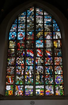 Gouda, the Nehterlands - April 20, 2023: The Stained glass number 28a The Liberation window 1947 by Charles Eyck in the Sint Janskerk