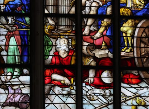 Gouda, the Nehterlands - April 20, 2023: The Stained glass window the Freedom of Conscience by Joachim Wtewael in the Sint Janskerk in Gouda, the Nehterlands