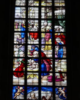 Gouda, the Nehterlands - April 20, 2023: The Stained glass number 11 - Birth of John the Baptist by Lambert van Noort  in the Sint Janskerk