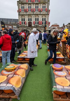 Gouda, the Nehterlands - April 20, 2023: The famous cheese market at the town hall in Gouda, the Nehterlands