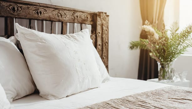 Clean Bedding sheets and pillow on natural wall room background. White bedding and pillow in hotel room. White pillows on empty bed.