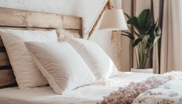 Clean Bedding sheets and pillow on natural wall room background. White bedding and pillow in hotel room. White pillows on empty bed.