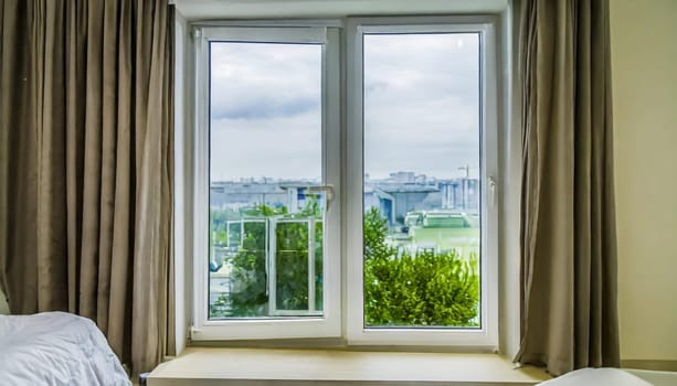 closed pvc window in room at apartment