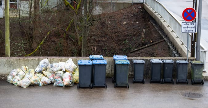 Pile of waste plastic trash bags and bins in Germany, garbage collection, environment and pollution concept, Trier, 13.03.2024