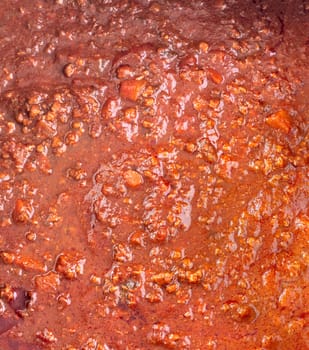 Pot of cooked italian bolognese sauce closeup