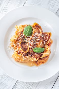 Portion of lumaconi pasta with bolognese sauce
