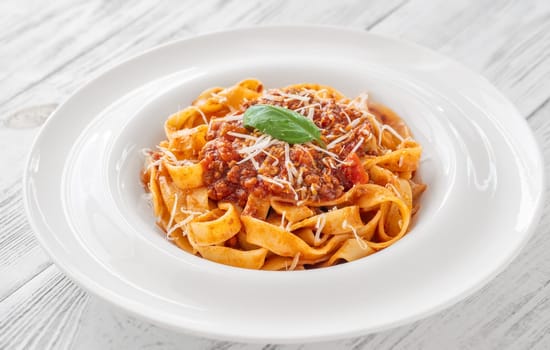 Portion of Tagliatelle pasta with bolognese sauce