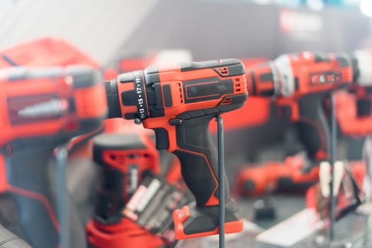 Power tools, drills and hammers of various manufacturers are sold in hardware store.