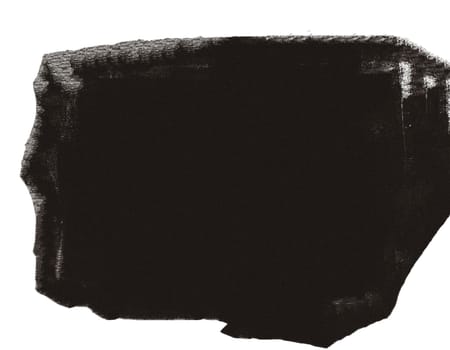 A large grunge stain with uneven edges on a white background