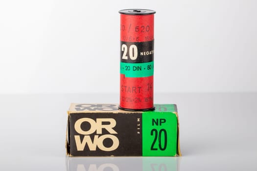 Potsdam, Germany - Aug 11, 2018. A old ORWO (Original Wolfen) NP20 (NP= Negative Panchromatic) film roll and its packaging on table over light background. Analogue vintage photography.