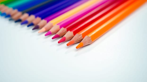 Set of colored pencils on a white background That is arranged in a bar graph, Color pencils on white background, Close up, seamless colored pencils row with wave on lower side, line pencils.
