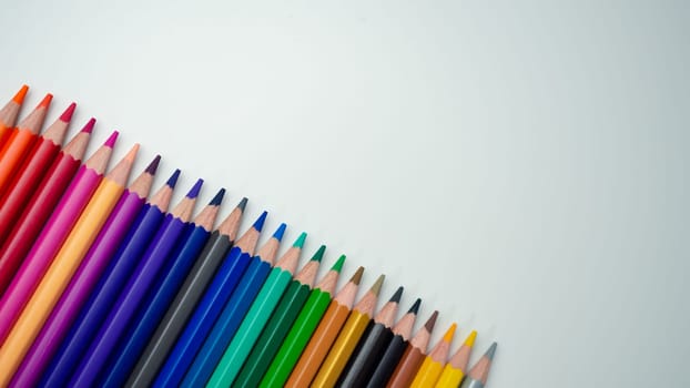 Set of colored pencils on a white background That is arranged in a bar graph, Color pencils on white background, Close up, seamless colored pencils row with wave on lower side, line pencils.