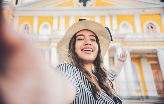 Girl lifestyle taking a self portrait in the square. Granada, Nicaragua. Happy tourist girl taking a selfie in a square