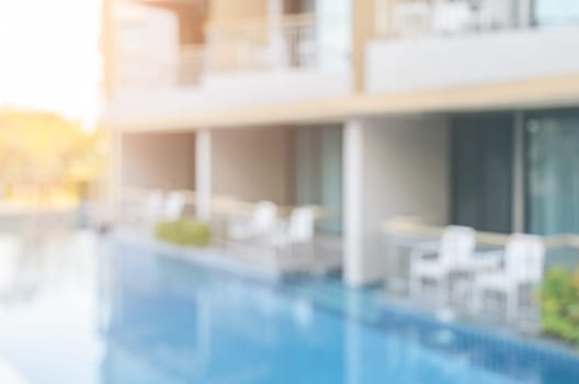 Abstract blurred image of outdoor swimming pool for background