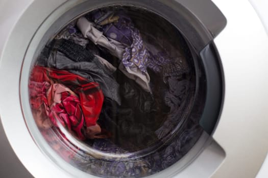 a close view of domestic washing machine at work.