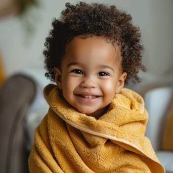 A child wrapped in a yellow towel after bath, showcasing the comfort and warmth