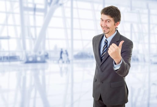 young business man going thumb up, at the office