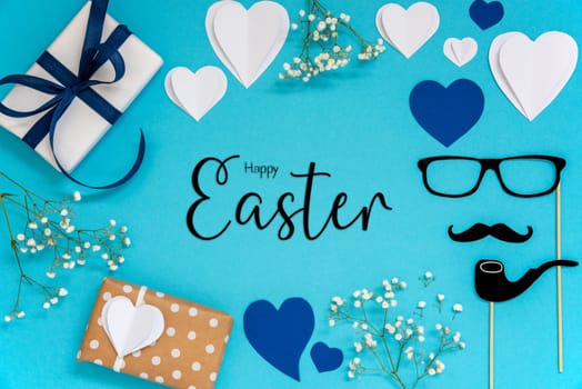 Flat Lay With English Text Happy Easter. Blue Accessories Like Presents, Hearts, Flowers And Male Decoration Like Mustache. Flat Lay With Turquoise Paper Background.