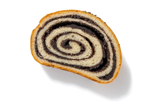 Enjoy a slice of German poppy seed cake, featuring a moist texture and a delightful poppy seed filling, presented against a clean white backdrop.